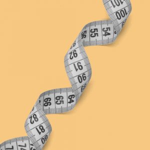 The long coil of a measuring tape across a yellow background. Applying Anti-Diet Practices in Recovery