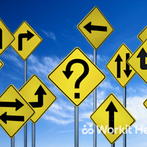 A collection of yellow traffic signs, all with arrows pointing in different directions, in front of a blue sky