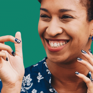 A smiling African American woman silhouetted against green. Horizon Healthcare Services