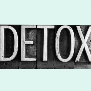 Typesetters blocks spelling out the word "Detox." Detox from alcohol