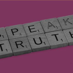 Scrabble tiles spell out "Speak Truth". Rationalizing drinking.