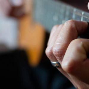 Closeup on a guiat being played