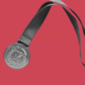 A gold medal on a red background. Achieving a new level of sobriety