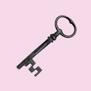 Old fashioned metal key on a lilac background. Tips for handling relapse and getting back into recovery.