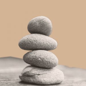 Four stones balanced atop one another. Slef-care