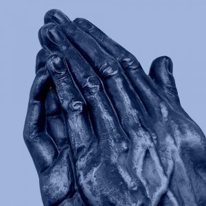 Sculpture of hands folded in prayer. The Serenity Prayer