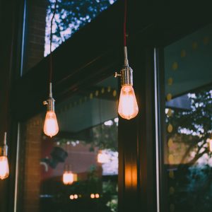 Trendy Edison bulbs hang in a restaurant.