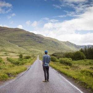 man-standing-on-road