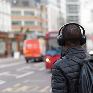 man-walking-with-headphones
