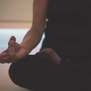 A person sitting in lotus position