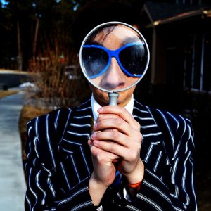 man-with-magnifying-glass